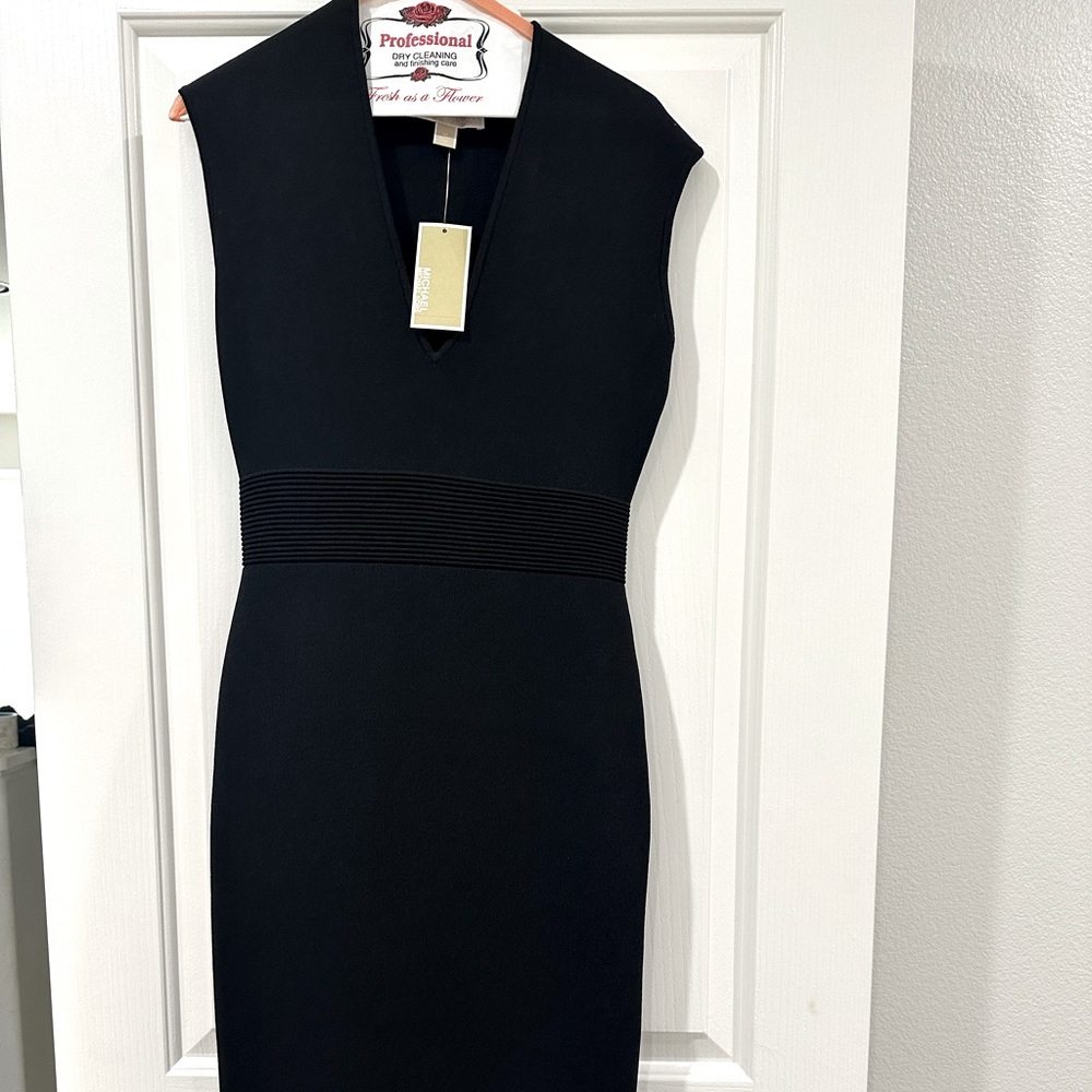 Black Michael Kors fitted dress.